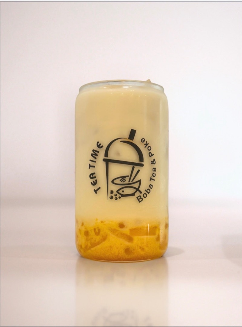 Triple mango green milk tea with mango popping boba